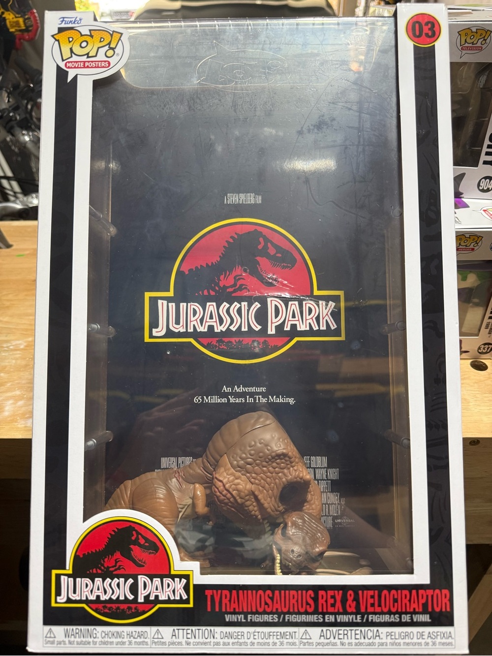 Funko POP! Jurassic Park Poster with Brown T. rex & Velociraptor Figures